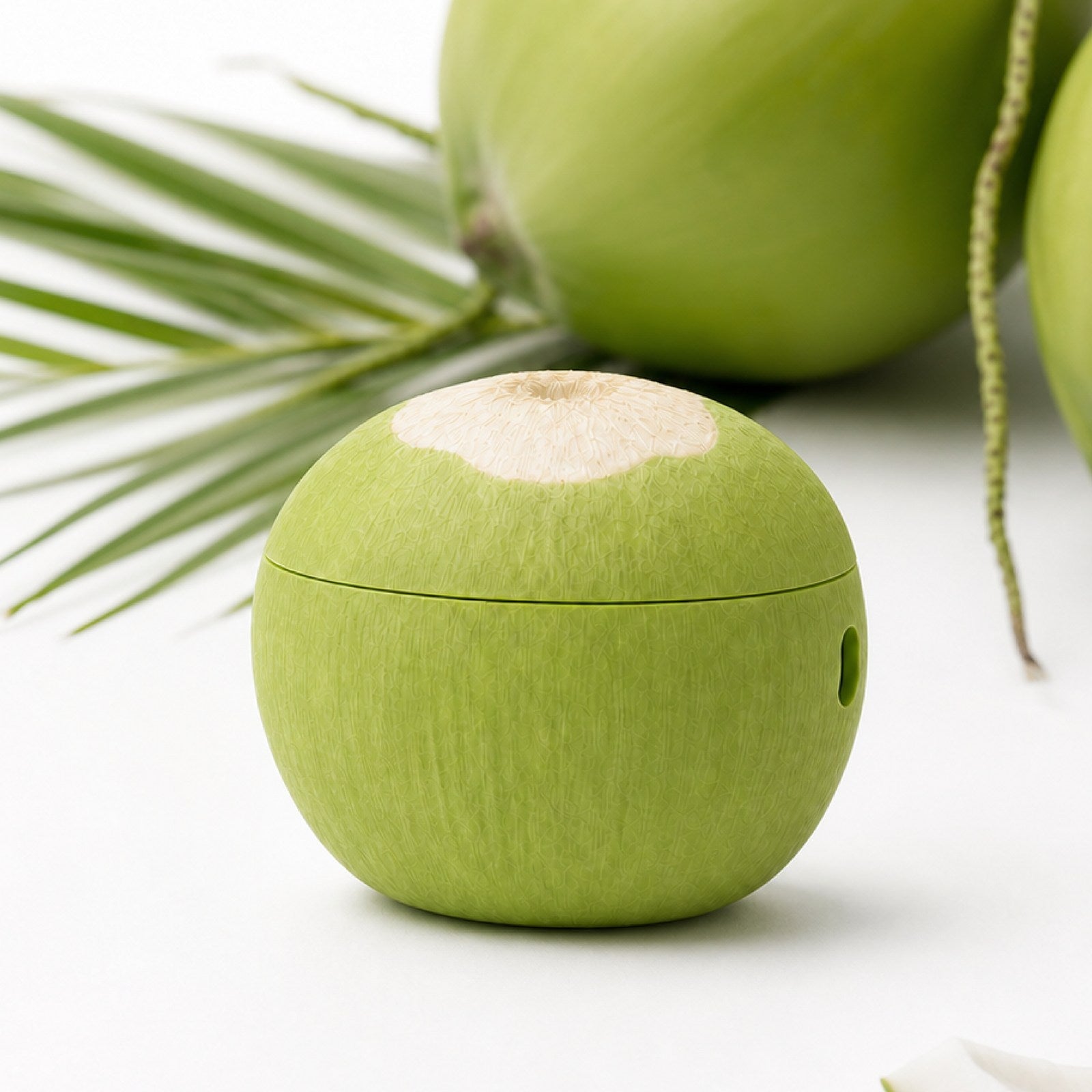Coconut AirPods case mixed with real coconuts